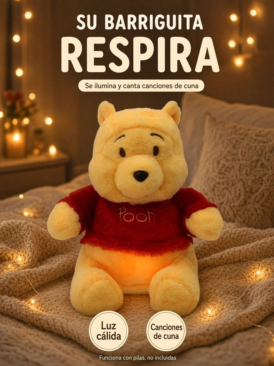 El Pooh que respira sentado sobre una cobija con lucecitas, de noche: su barriguita respira, se ilumina y canta canciones de cuna