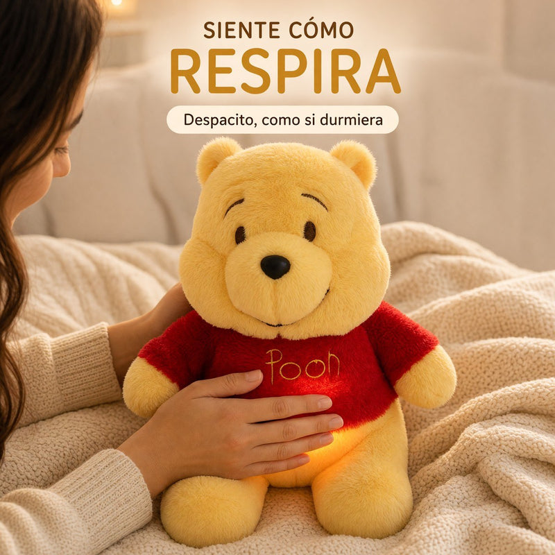 Una mano siente cómo respira la barriguita encendida del Pooh