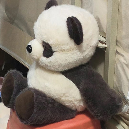 Peluche panda que corre de lado